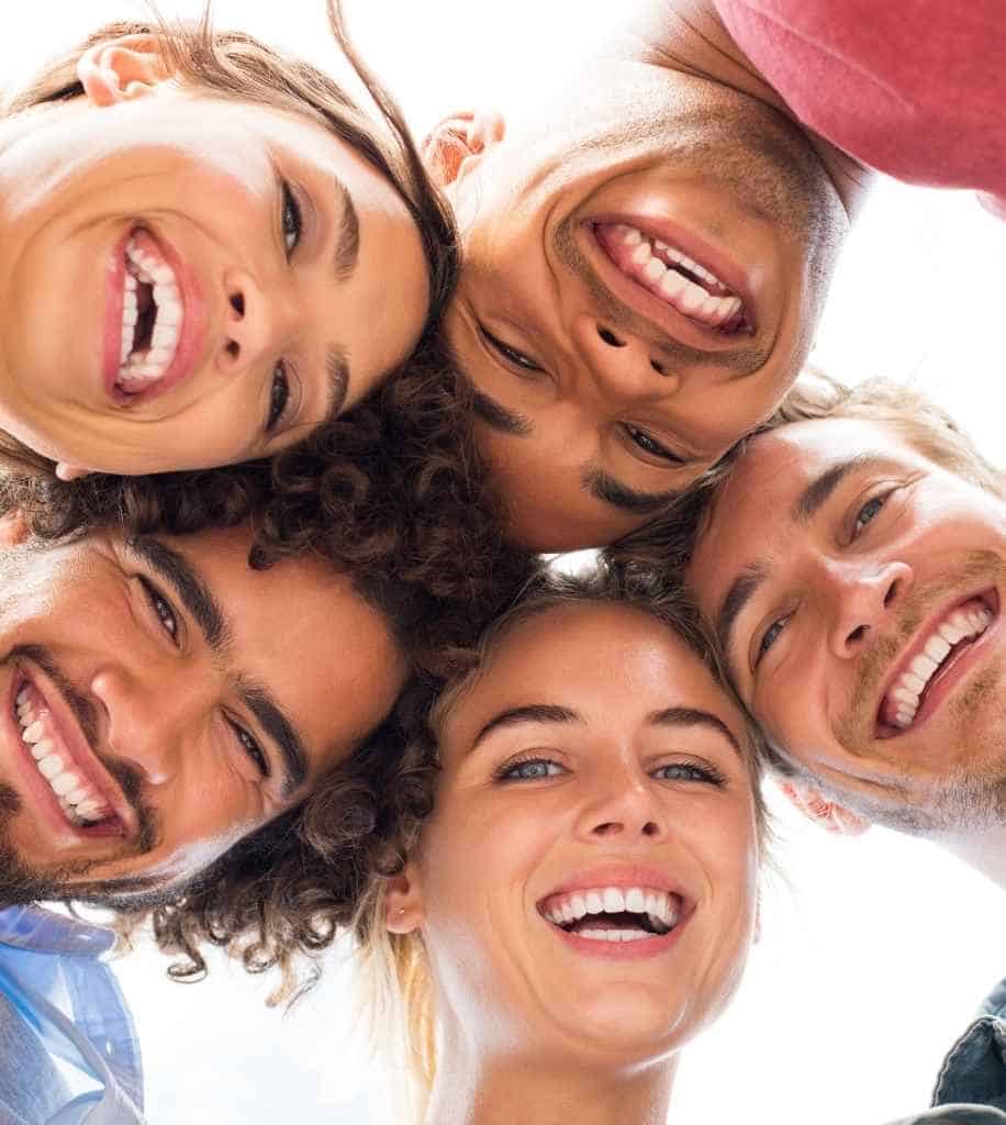 Smiling person showcasing white teeth after laser whitening treatment York